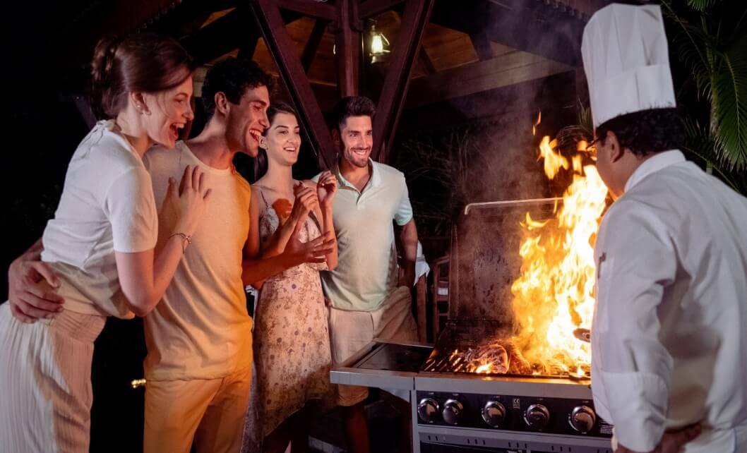 Couples Admiring Food on Grill