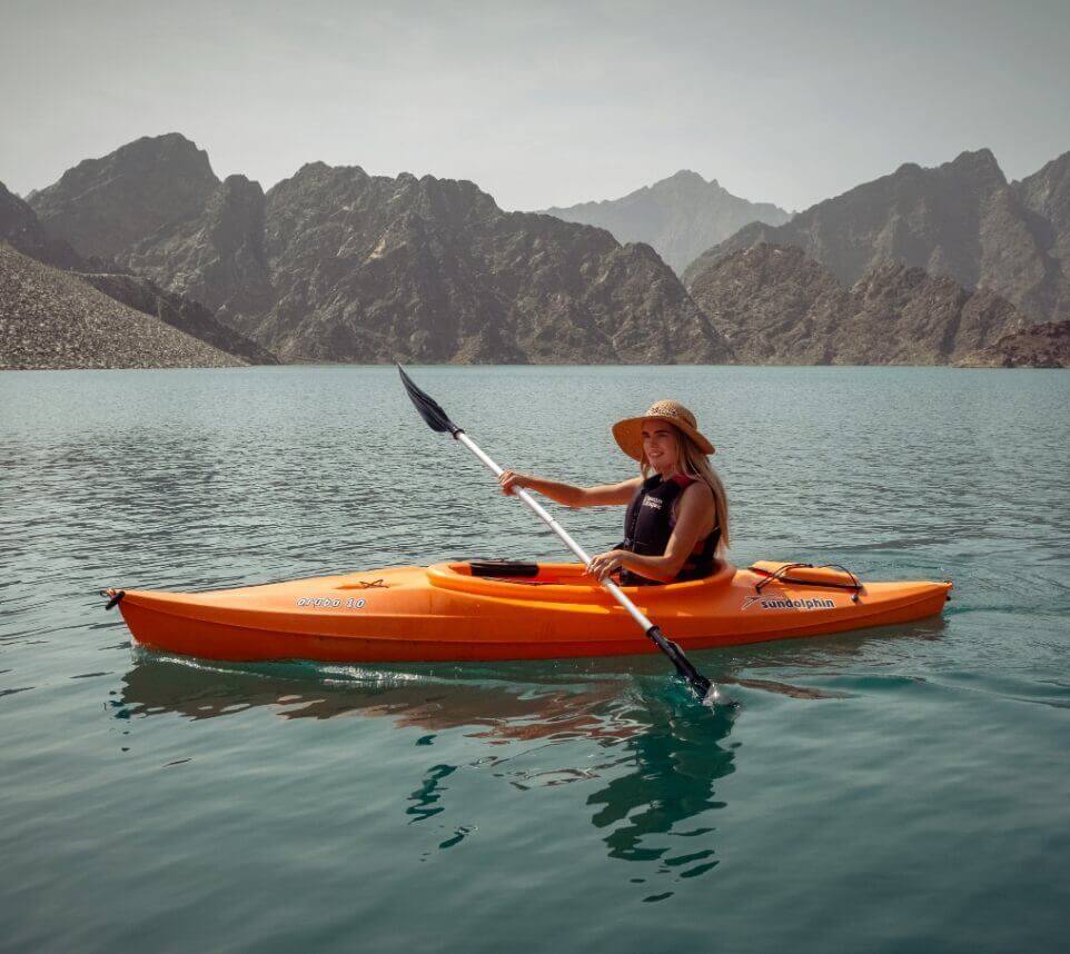 Woman Kayaking on Lake