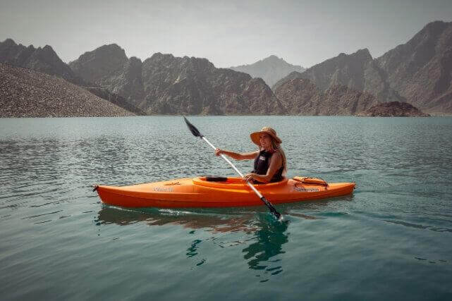 Woman Kayaking on Lake