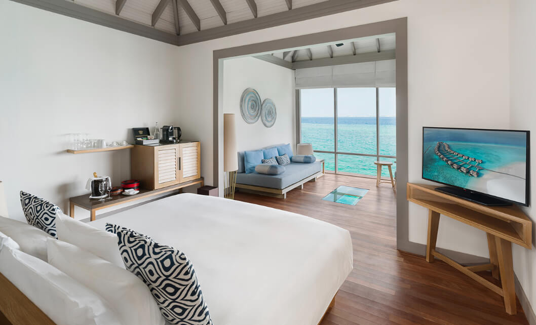 JA_Manafaru_Accommodation_Sunset_Water_Villa_Bedroom_2024.jpg
