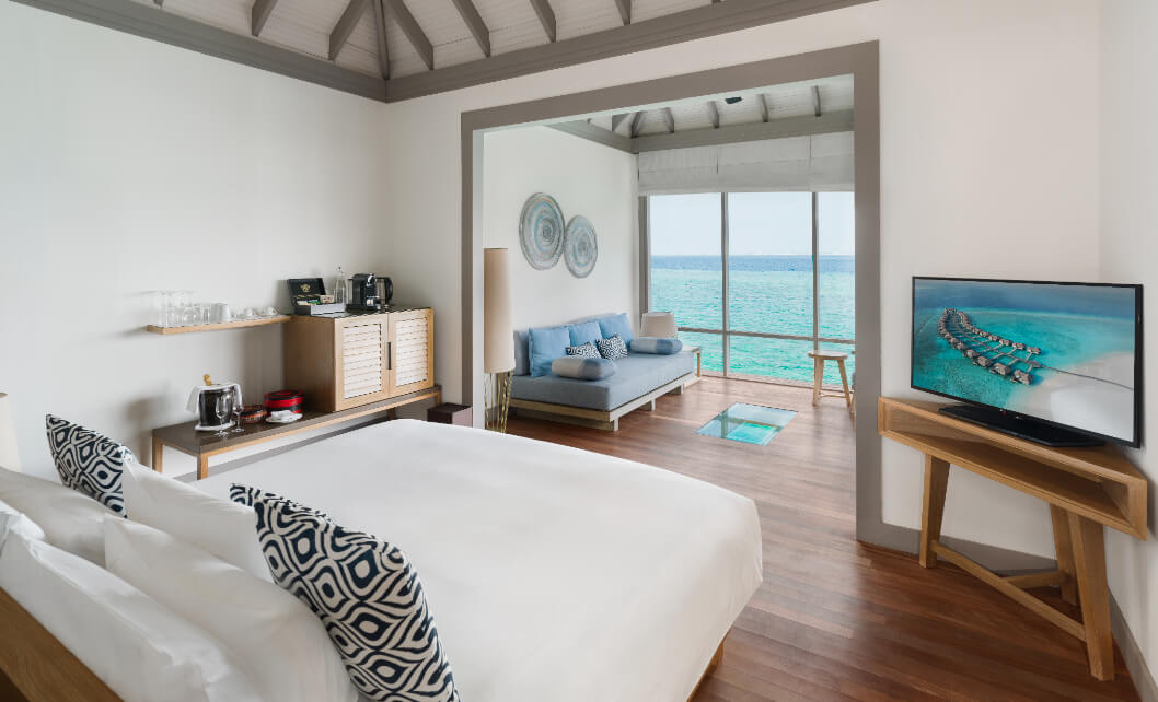 JA_Manafaru_Accomodation_Sunset_Water_Villa_Bedroom_2024.jpg