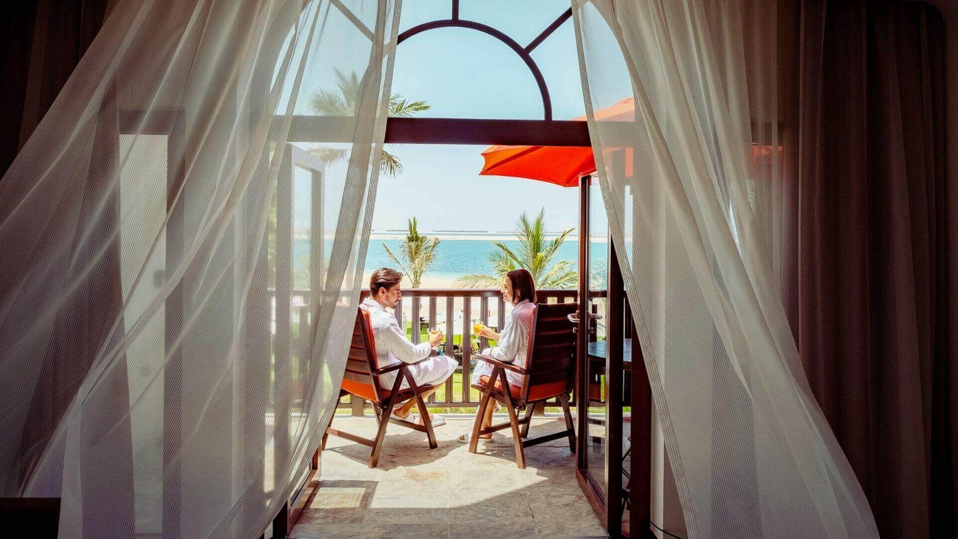 Couple On Resort Balcony