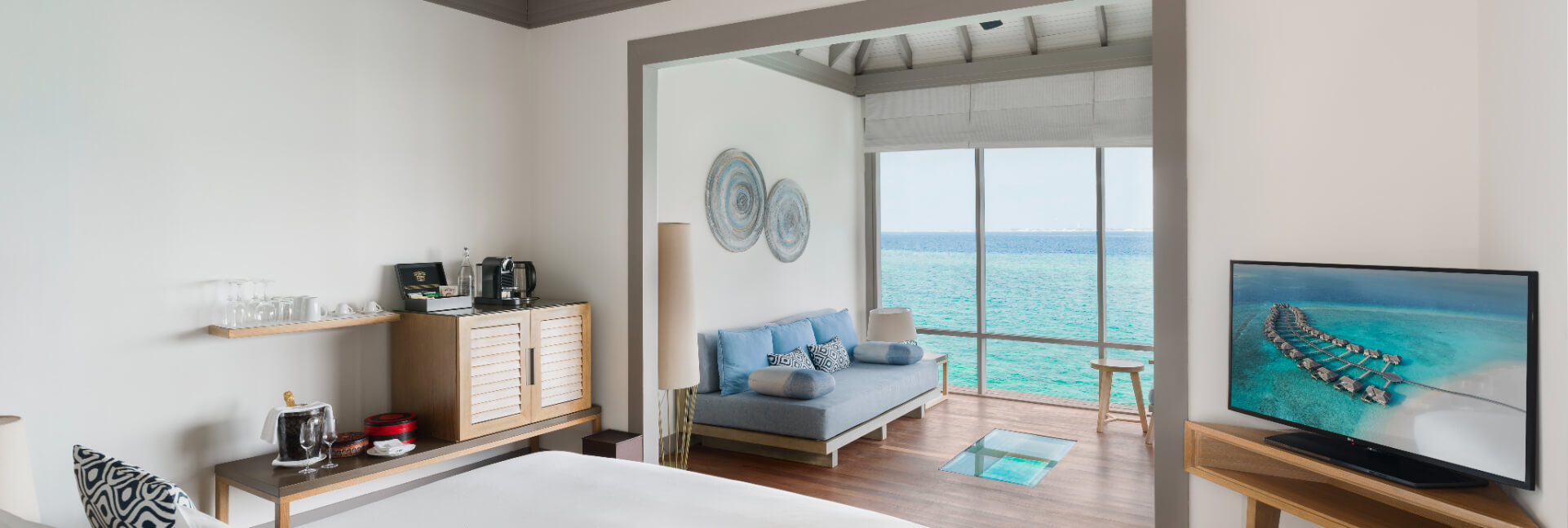 JA_Manafaru_Accomodation_Sunset_Water_Villa_Bedroom_2024.jpg