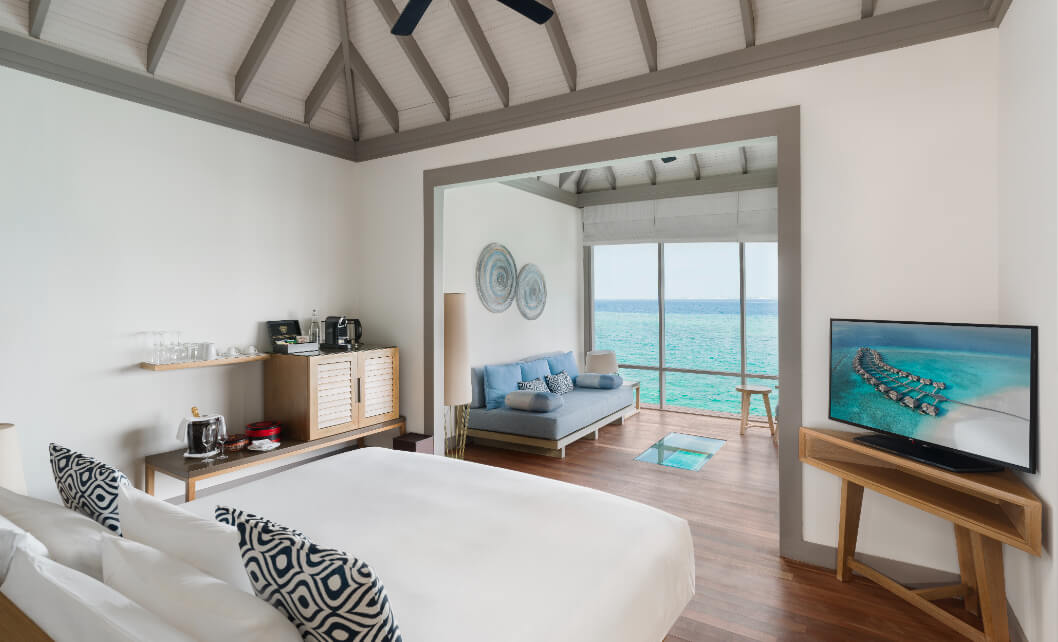 JA_Manafaru_Accomodation_Sunset_Water_Villa_Bedroom_2024.jpg