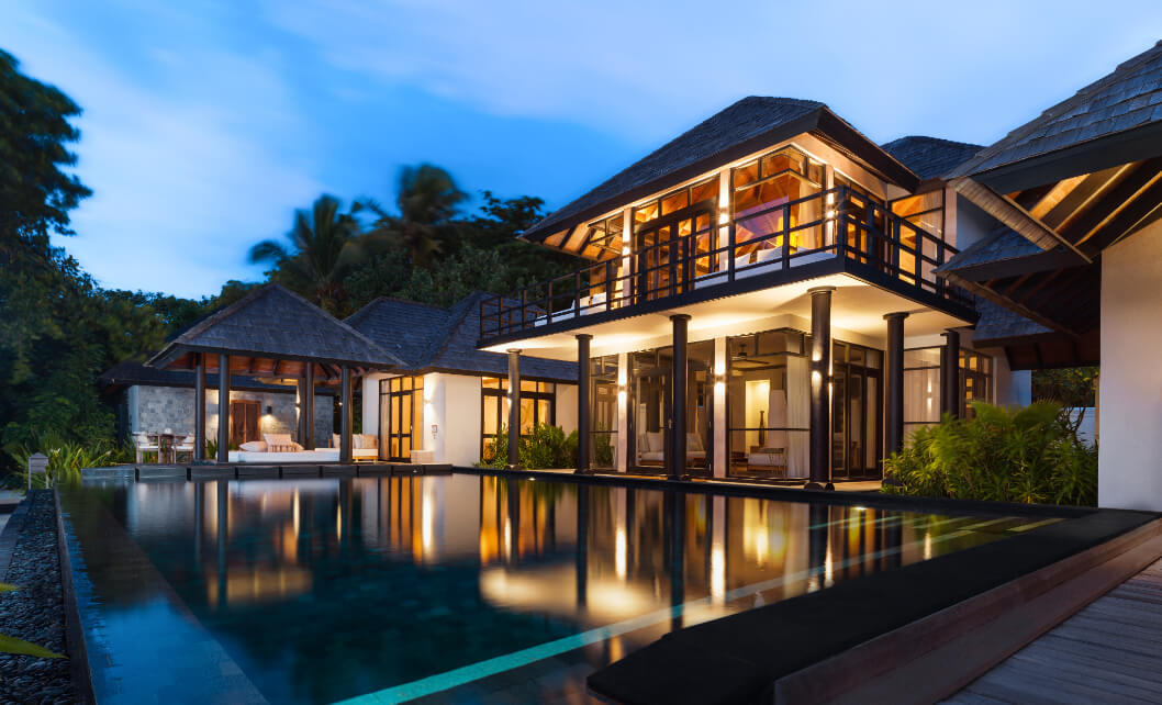 JA_Manafaru_Aerial_Accommodation_Beach Residence_2BR_Beach_2024_Night Shot.jpg