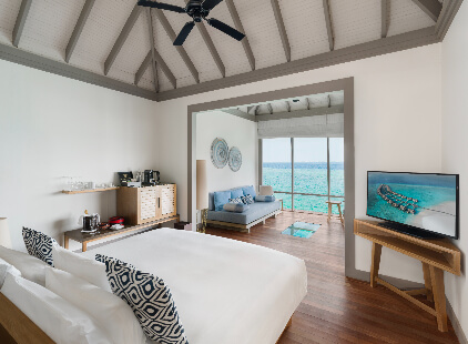 JA_Manafaru_Accomodation_Sunset_Water_Villa_Bedroom_2024.jpg