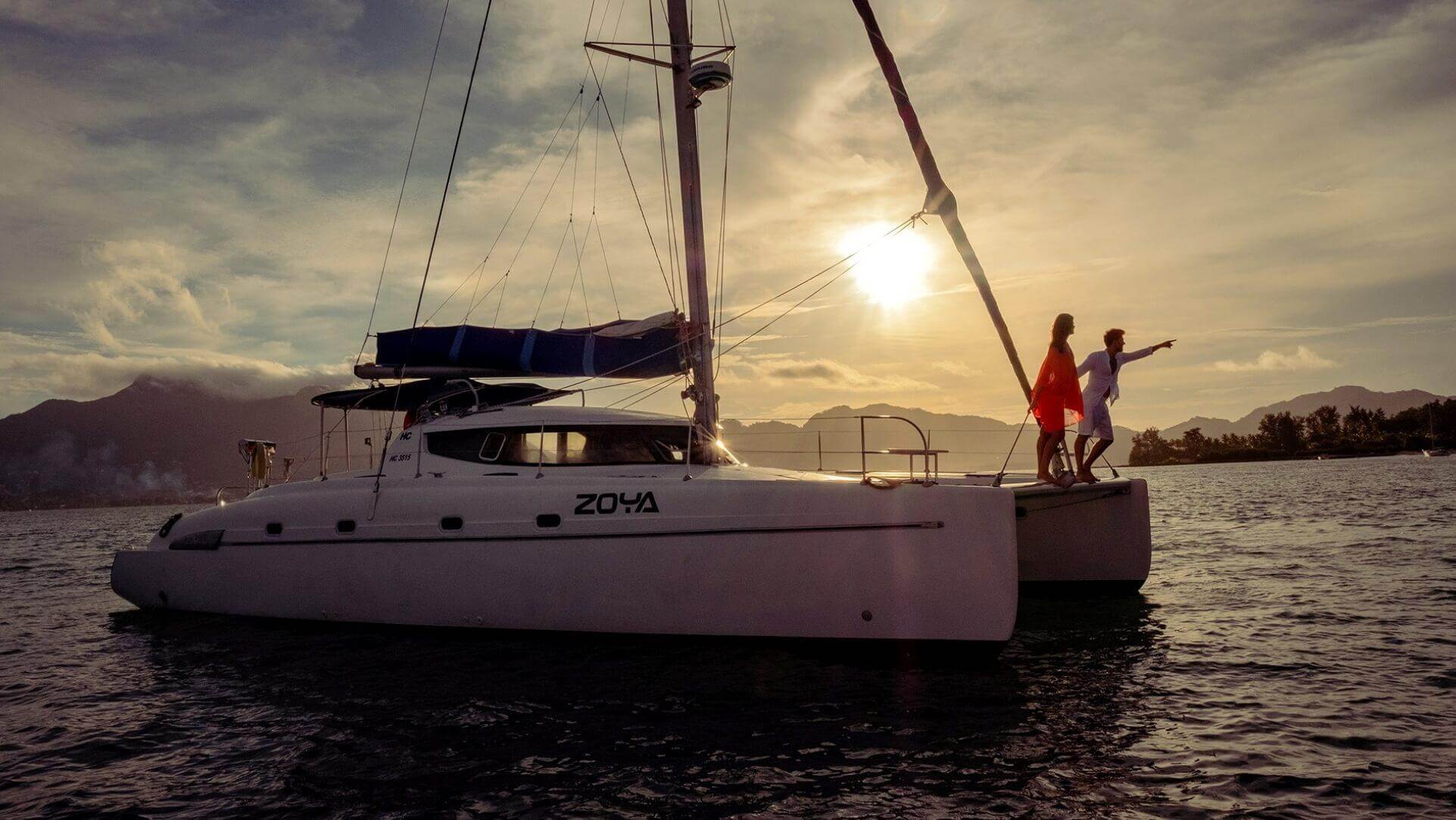 Couple on Catamaran at Sunset