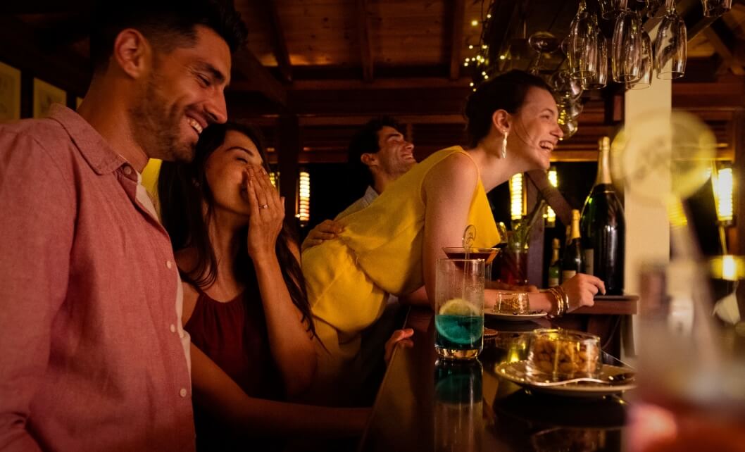 Friends Laughing at Bar