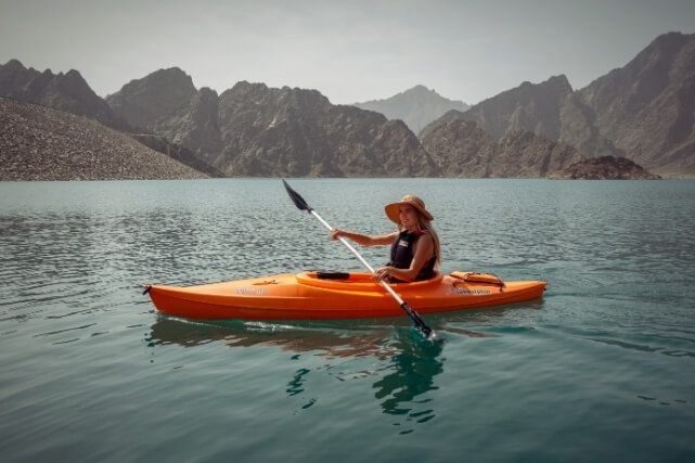 Woman Kayaking on Lake