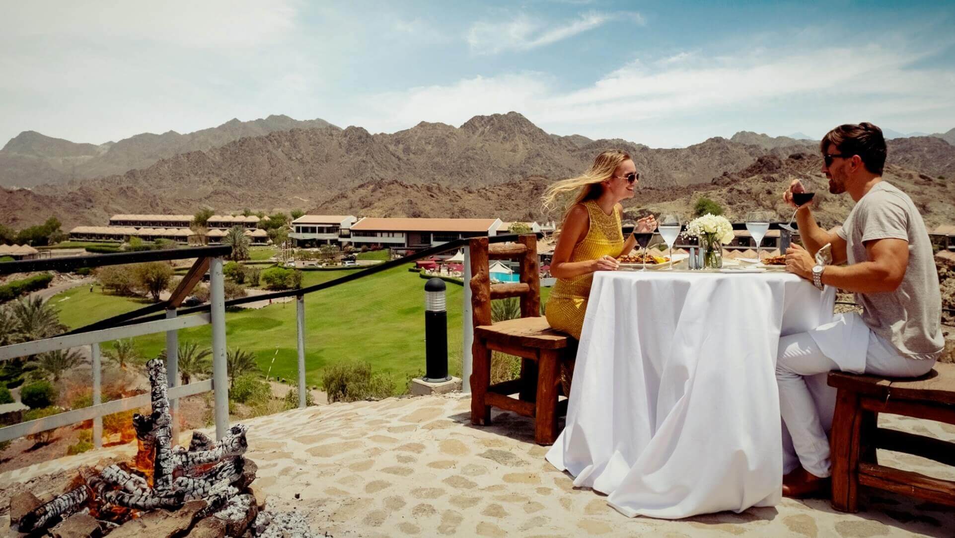 Couple Toasting On Patio with Mountain View