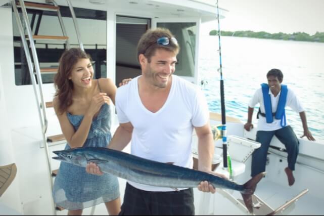 Couple Fishing on Boat