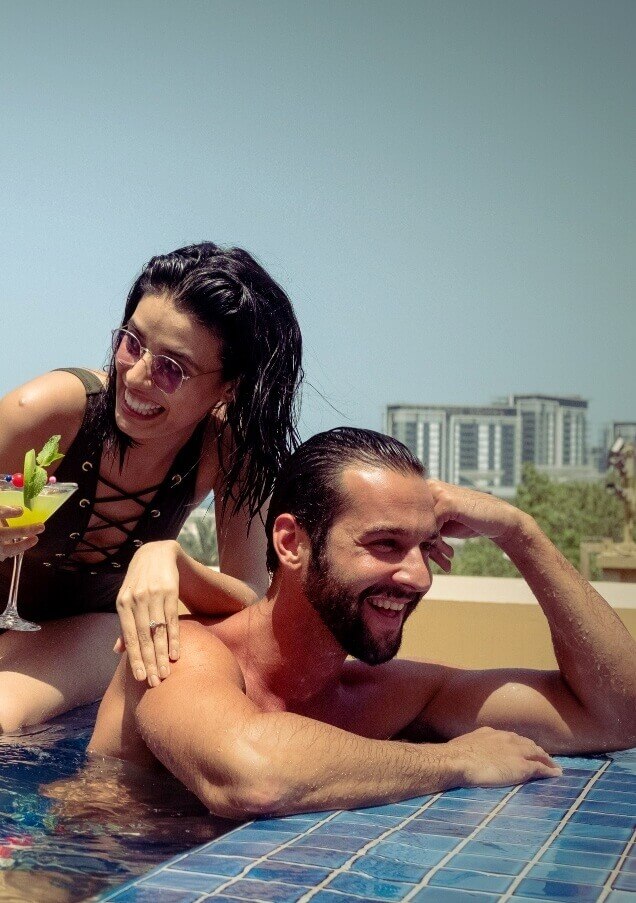 Couple Having Cocktails In Pool