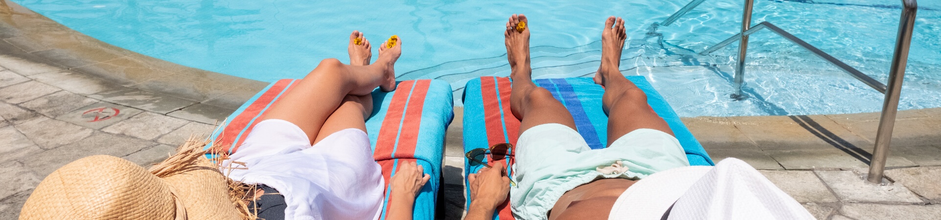Couple Laying out by Pool