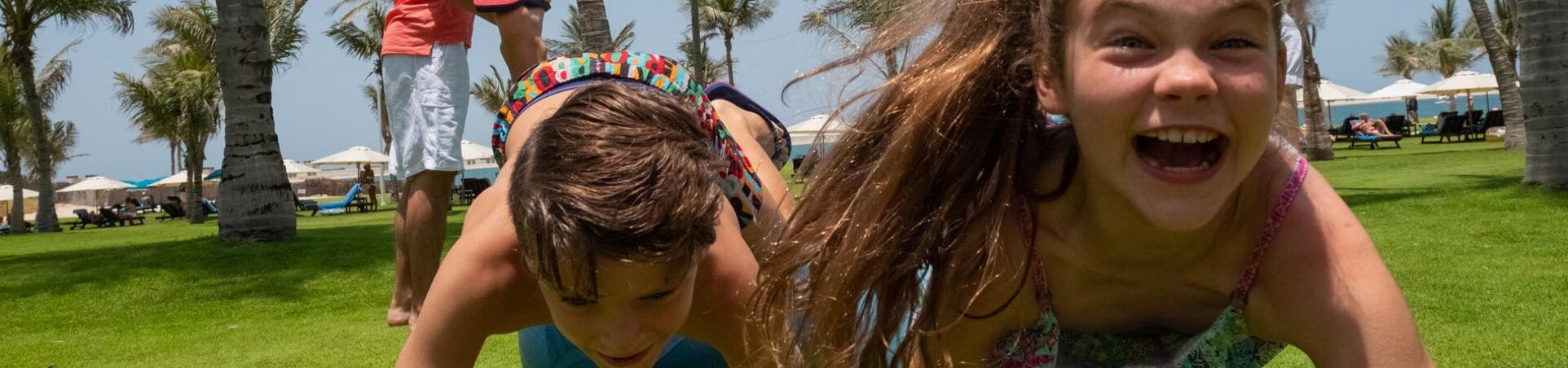 Kids Crawling on Grass